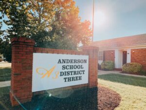 Photo of Anderson District 3 sign outside of school building