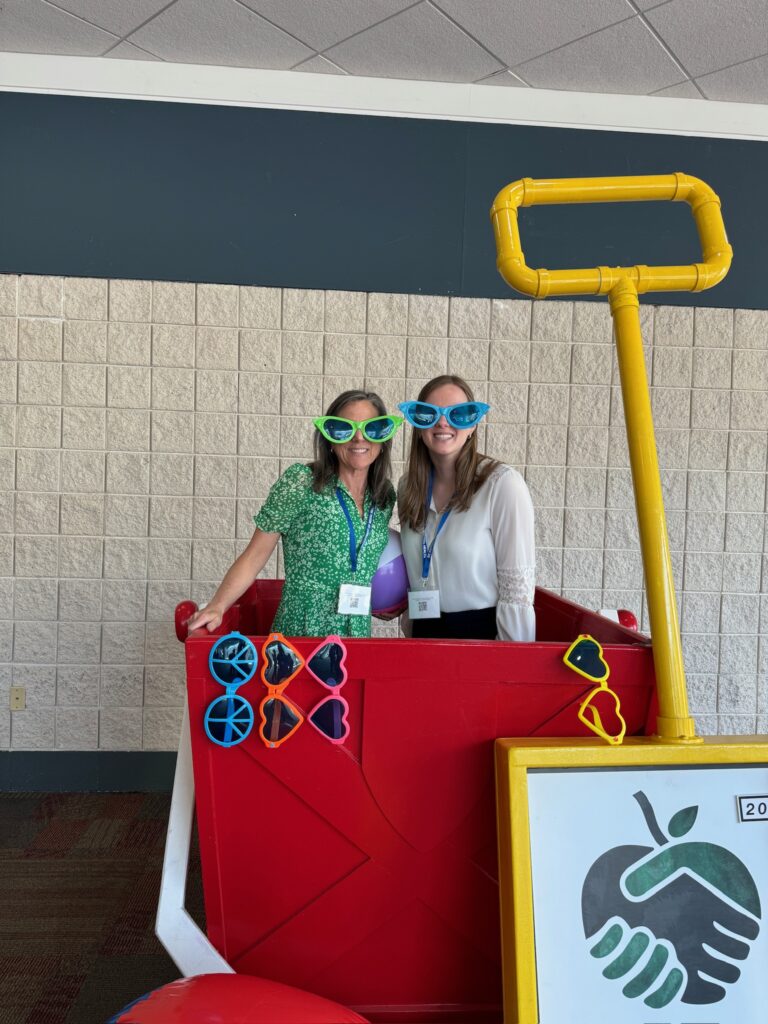 photo of georgia mckown and karen elfner wearing large sunglasses in a photo both at a conference